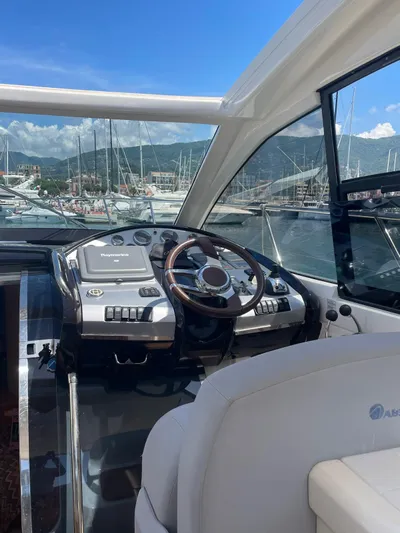  Yacht Photos Pics Helm of 2008 Absolute 47 HT yacht with marina view.