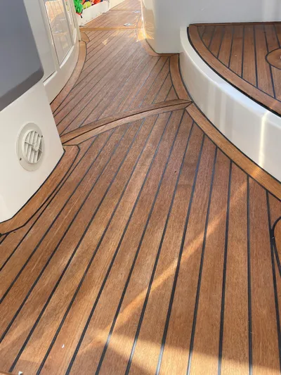  Yacht Photos Pics Teak deck of 2008 Absolute 47 HT yacht, showcasing elegant wood finish.