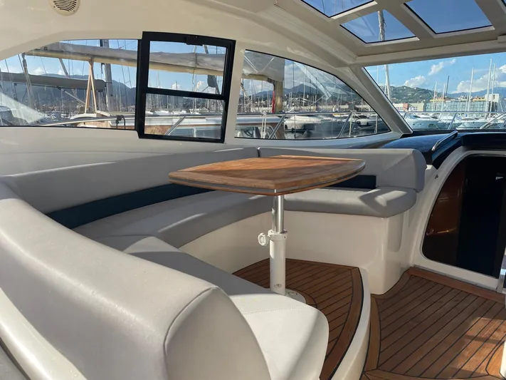  Yacht Photos Pics Luxurious interior of a 2008 Absolute 47 HT yacht with elegant seating and wooden table.