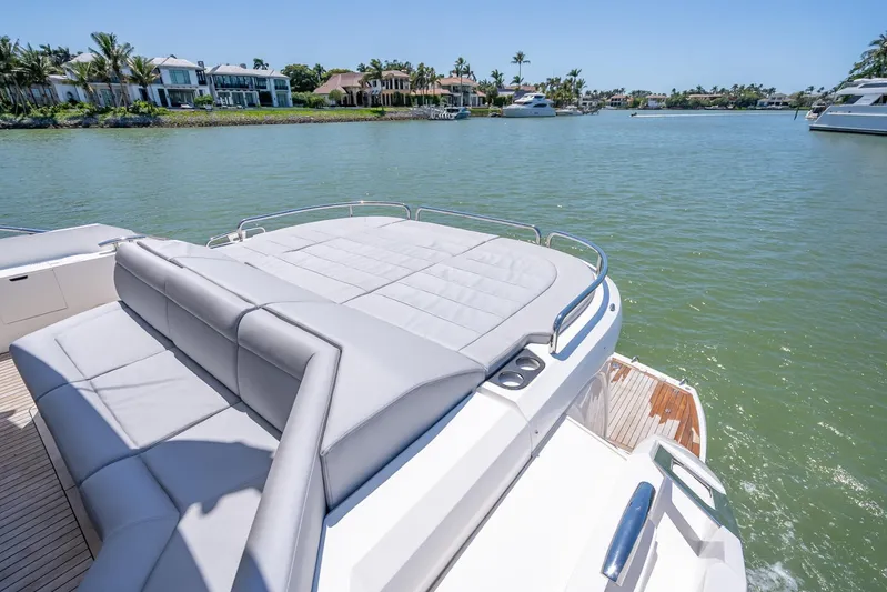 Midnight Oil Yacht Photos Pics Luxurious 2018 Sunseeker Predator 57 yacht with spacious sunbathing deck on tranquil waters.