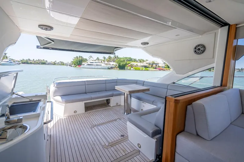 Midnight Oil Yacht Photos Pics Luxurious 2018 Sunseeker Predator 57 yacht interior with spacious seating and scenic water view.