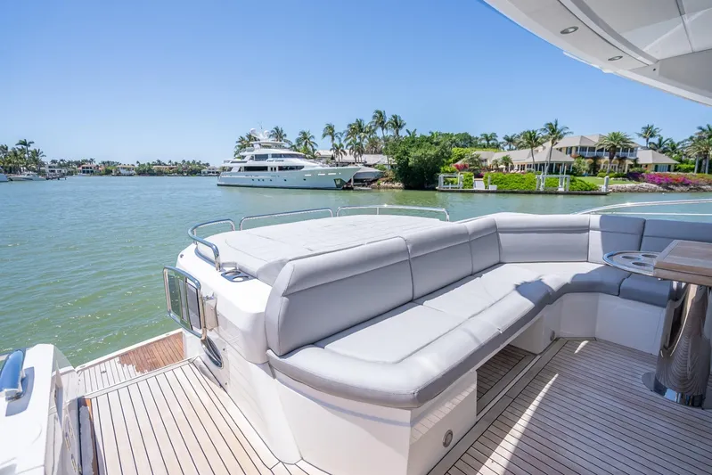 Midnight Oil Yacht Photos Pics Luxurious 2018 Sunseeker Predator 57 yacht with spacious deck and waterfront view.