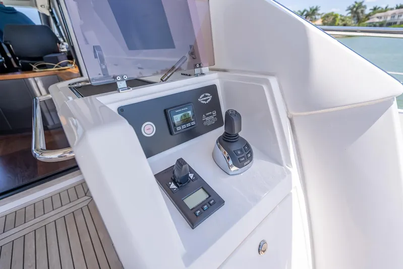 Midnight Oil Yacht Photos Pics Control panel of a 2018 Sunseeker Predator 57 yacht, featuring navigation instruments.