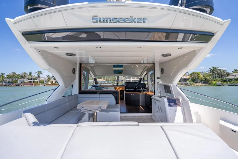 Midnight Oil Yacht Photos Pics Luxurious 2018 Sunseeker Predator 57 yacht interior with spacious seating and scenic water view.