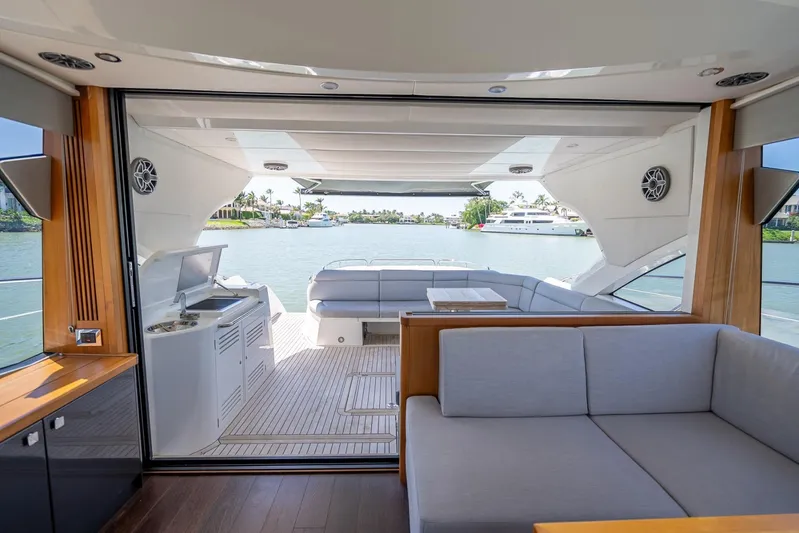 Midnight Oil Yacht Photos Pics Luxurious interior of 2018 Sunseeker Predator 57 yacht with waterfront view.