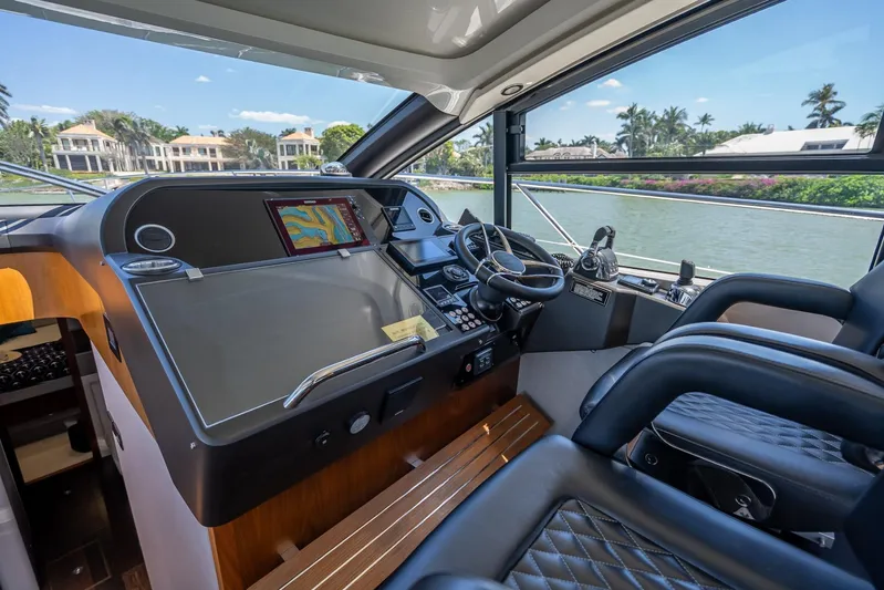 Midnight Oil Yacht Photos Pics Interior cockpit of 2018 Sunseeker Predator 57 yacht with navigation system.