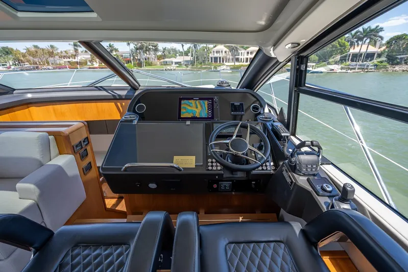 Midnight Oil Yacht Photos Pics Helm of 2018 Sunseeker Predator 57 yacht with modern navigation equipment and luxurious seating.