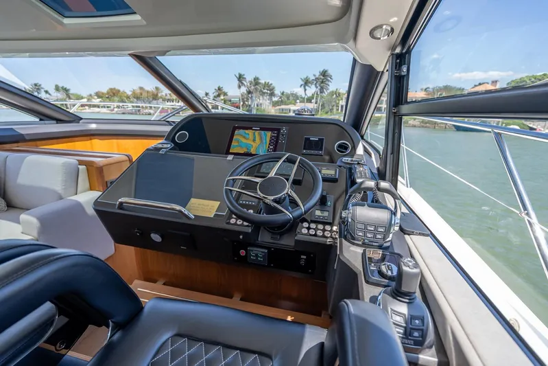 Midnight Oil Yacht Photos Pics Helm of 2018 Sunseeker Predator 57 yacht with modern navigation equipment and luxurious seating.