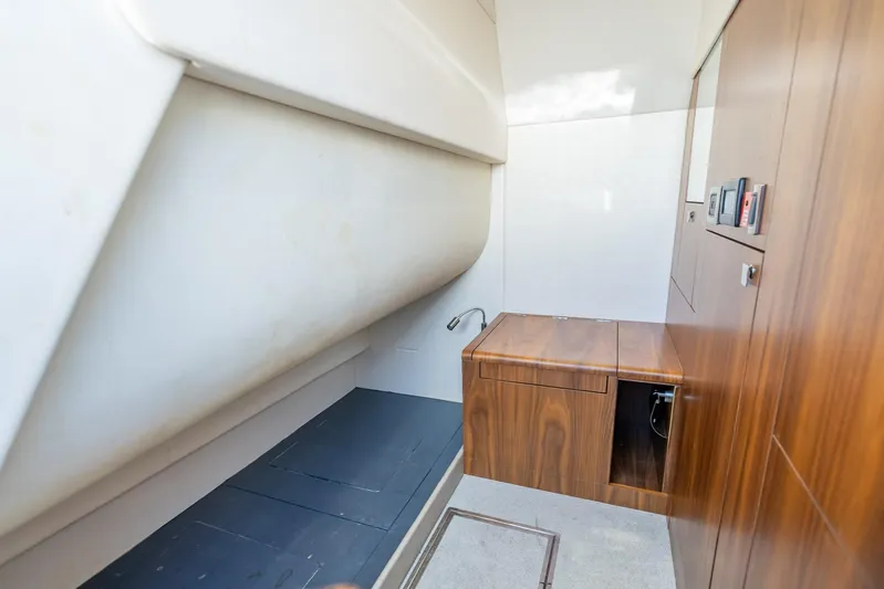 Midnight Oil Yacht Photos Pics Interior of 2018 Sunseeker Predator 57 yacht, featuring sleek wood cabinetry and modern design.