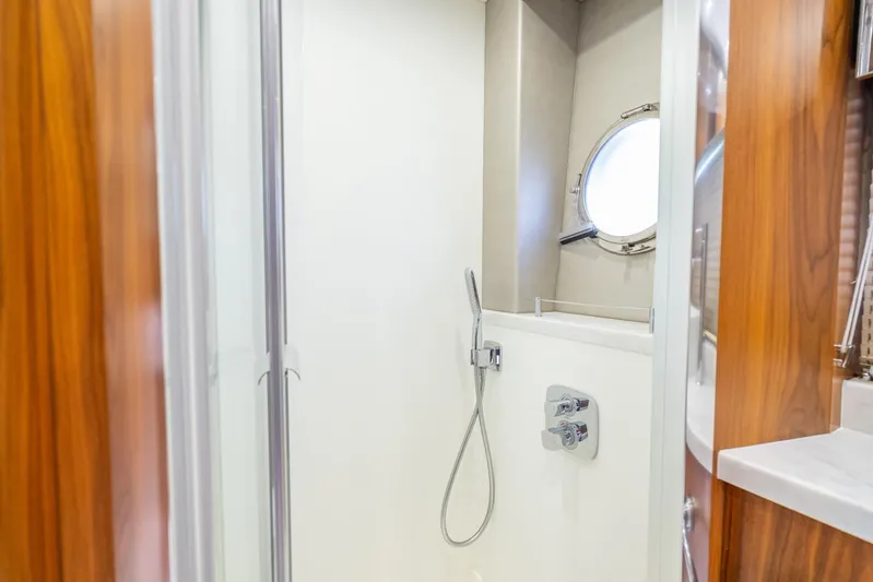 Midnight Oil Yacht Photos Pics Luxurious shower area in 2018 Sunseeker Predator 57 yacht with modern fixtures.