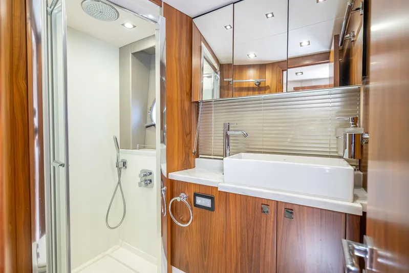 Midnight Oil Yacht Photos Pics Luxurious bathroom interior of 2018 Sunseeker Predator 57 yacht with modern fixtures.