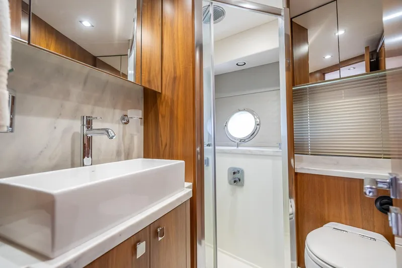Midnight Oil Yacht Photos Pics Luxurious bathroom interior of 2018 Sunseeker Predator 57 yacht with modern fixtures.