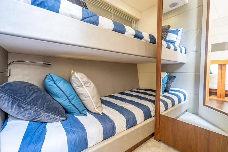 Midnight Oil Yacht Photos Pics Bunk beds with striped bedding in 2018 Sunseeker Predator 57 yacht cabin.
