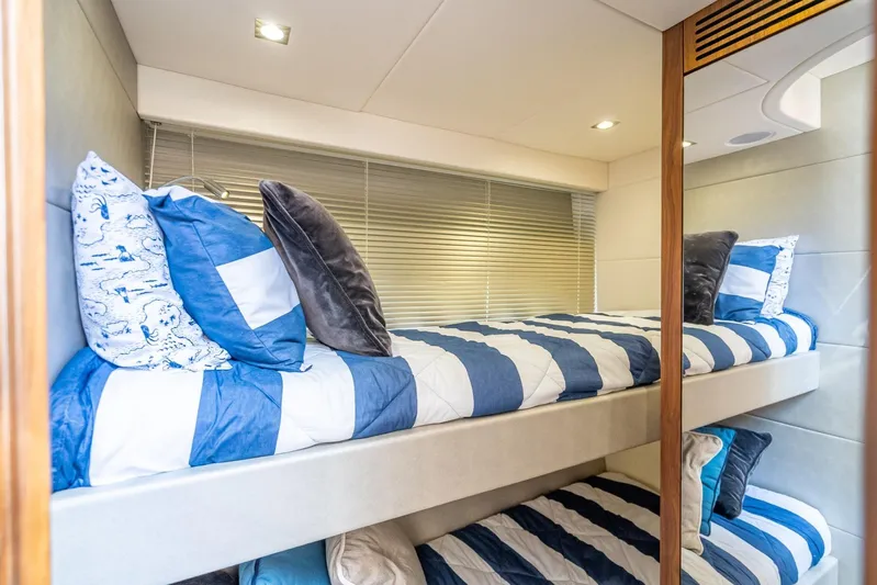 Midnight Oil Yacht Photos Pics Bunk beds with striped bedding in 2018 Sunseeker Predator 57 yacht cabin.