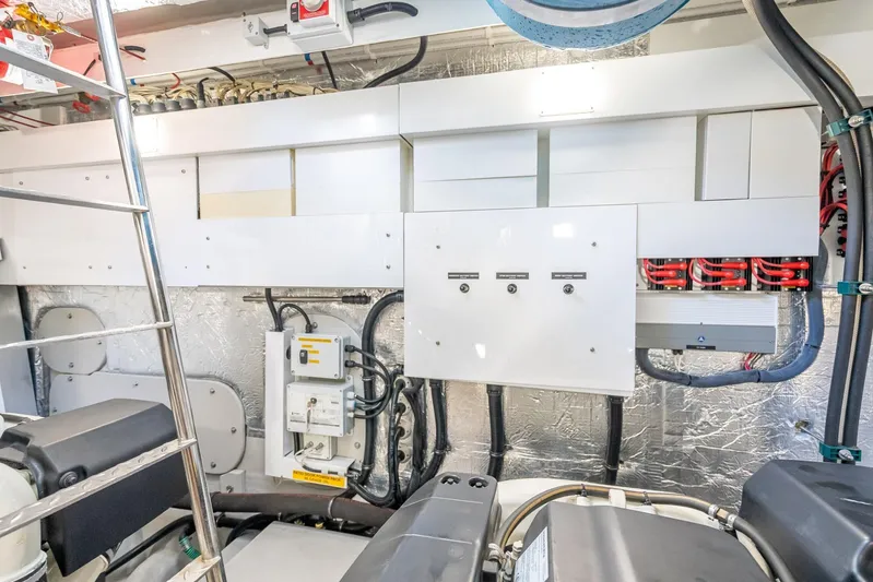 Midnight Oil Yacht Photos Pics Engine room of 2018 Sunseeker Predator 57 yacht, showcasing electrical systems and components.