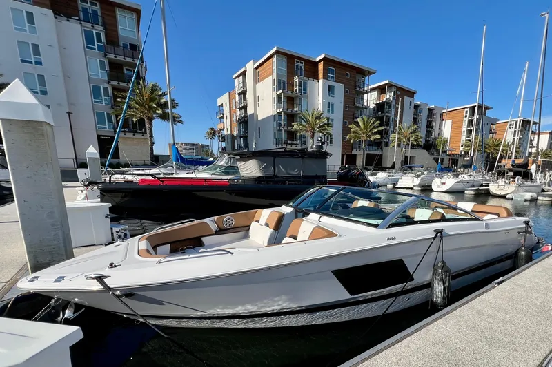  Yacht Photos Pics 2019 Four Winns Horizon H290 boat docked in a modern marina setting.