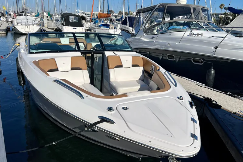  Yacht Photos Pics 2019 Four Winns Horizon H290 boat docked in a marina, surrounded by other vessels.