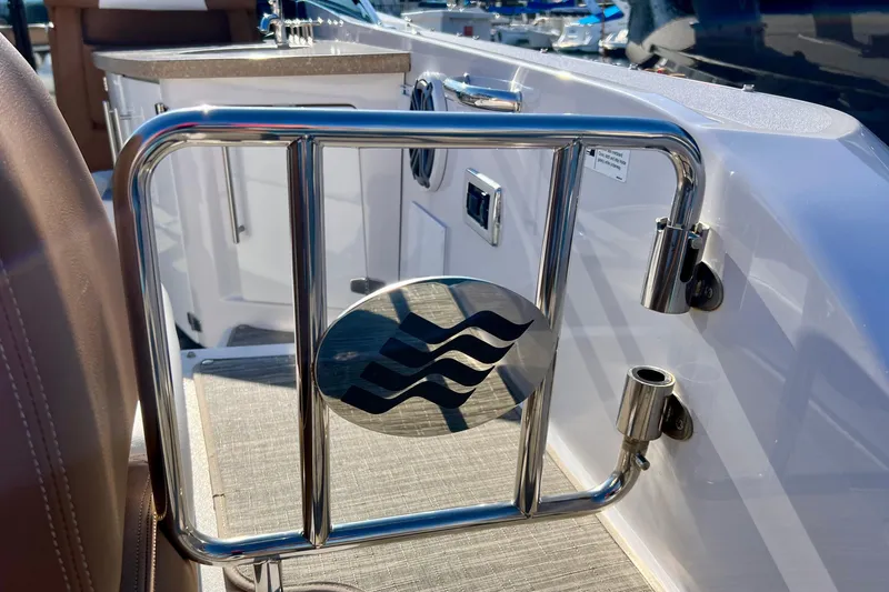  Yacht Photos Pics 2019 Four Winns Horizon H290 boat interior with stainless steel gate and wave emblem.