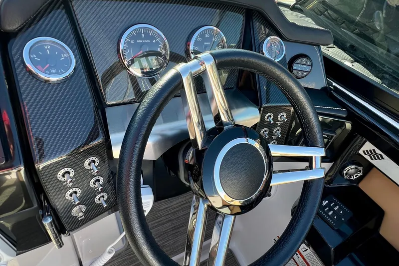  Yacht Photos Pics 2019 Four Winns Horizon H290 dashboard with sleek steering wheel and modern gauges.
