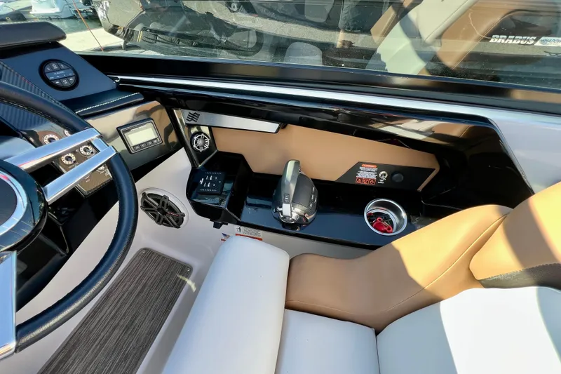  Yacht Photos Pics 2019 Four Winns Horizon H290 boat cockpit with steering wheel and control panel.