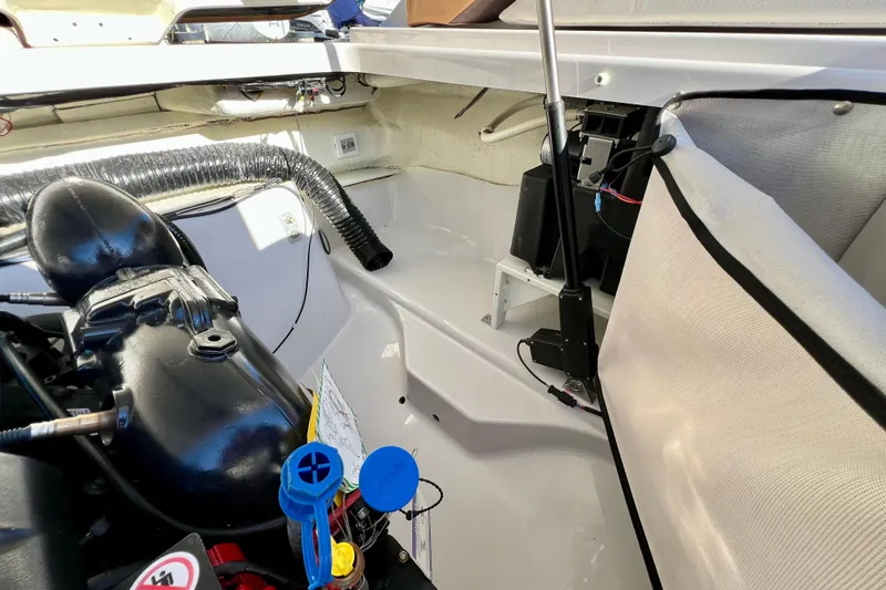  Yacht Photos Pics Engine compartment of 2019 Four Winns Horizon H290 boat, showcasing mechanical components and wiring.