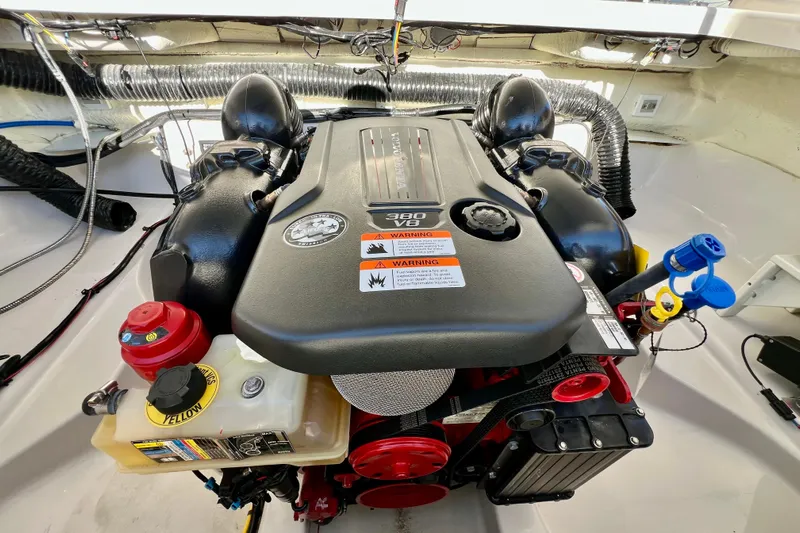  Yacht Photos Pics 2019 Four Winns Horizon H290 engine compartment with V6 engine and warning labels.