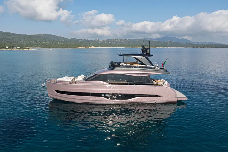  Yacht Photos Pics 2025 Cranchi Sessantadue 62 yacht on serene blue waters, scenic coastal backdrop.