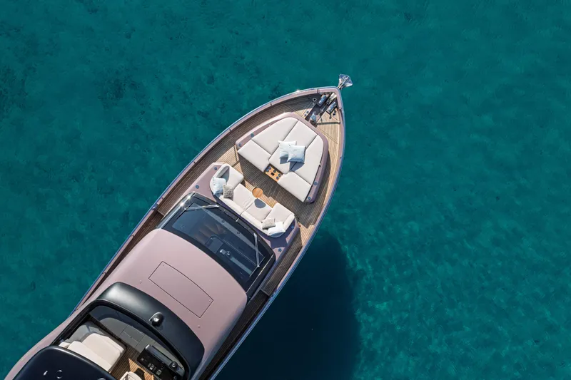  Yacht Photos Pics Aerial view of 2025 Cranchi Sessantadue 62 yacht on clear blue water.