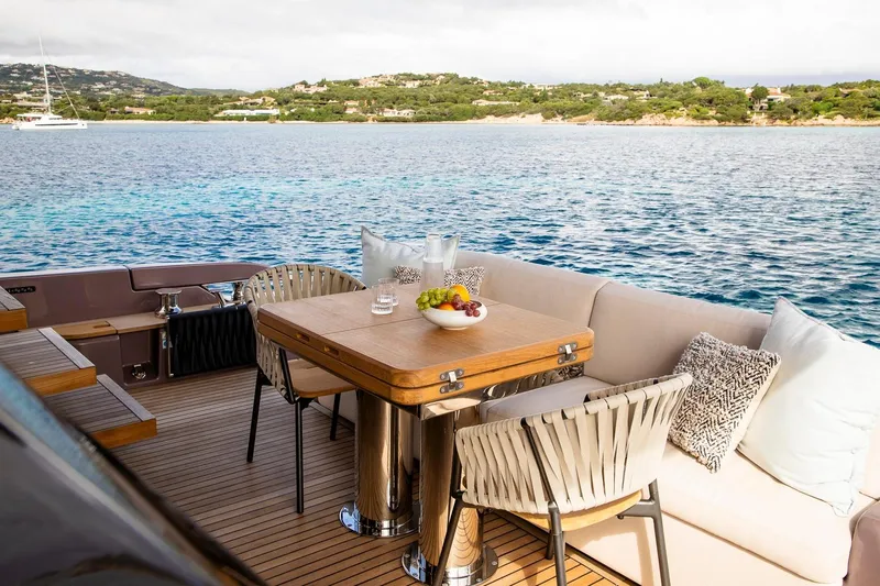  Yacht Photos Pics Luxurious deck of 2025 Cranchi Sessantadue 62 yacht with elegant seating and ocean view.