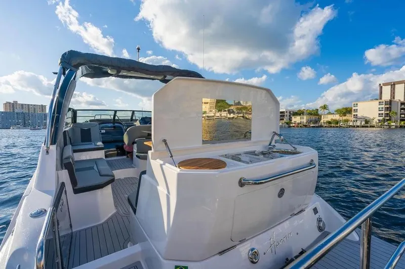  Yacht Photos Pics Luxury Hanover 305 boat, 2025 model, with sleek design and waterfront view.
