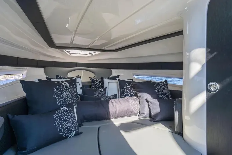  Yacht Photos Pics Luxurious interior of 2025 Hanover 305 boat with elegant cushions and modern design.