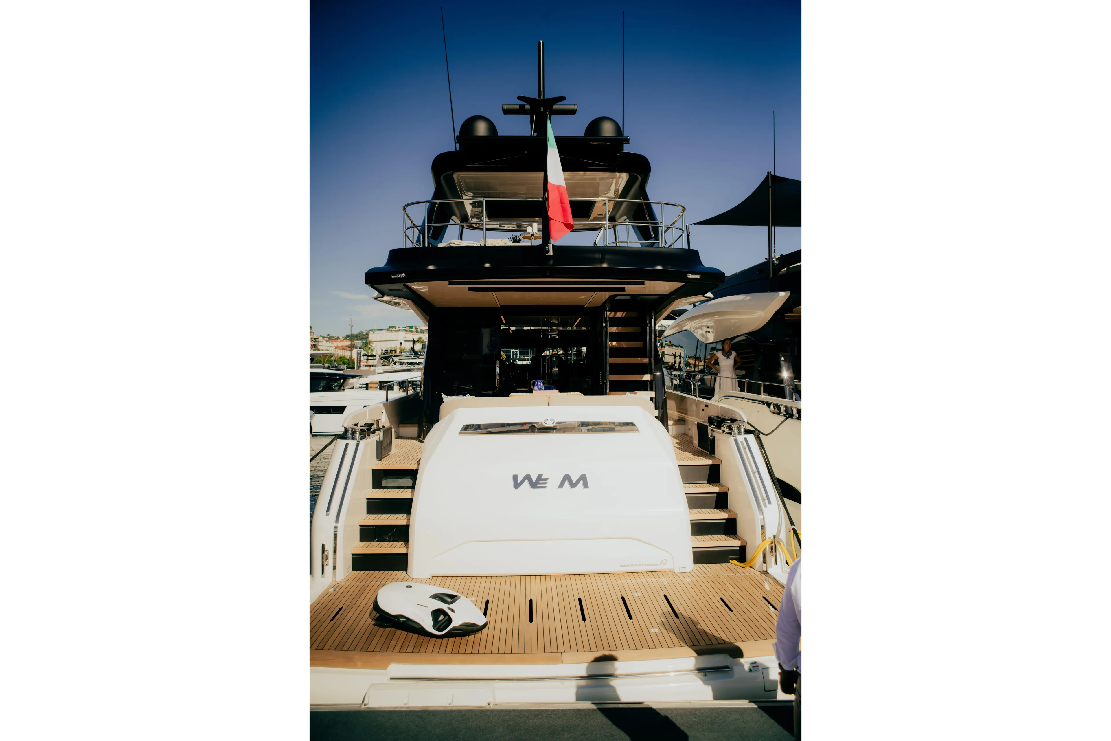  Yacht Photos Pics Luxury Cranchi Sessantadue 62 yacht, 2026 model, docked with elegant design and Italian flag.