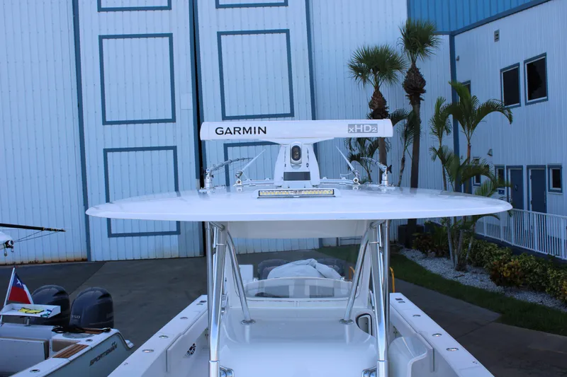  Yacht Photos Pics 1998 Venture 34 Open boat with Garmin radar, docked near palm trees.