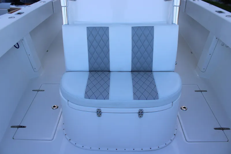  Yacht Photos Pics White cushioned seat with diamond pattern on a 1998 Venture 34 Open boat.
