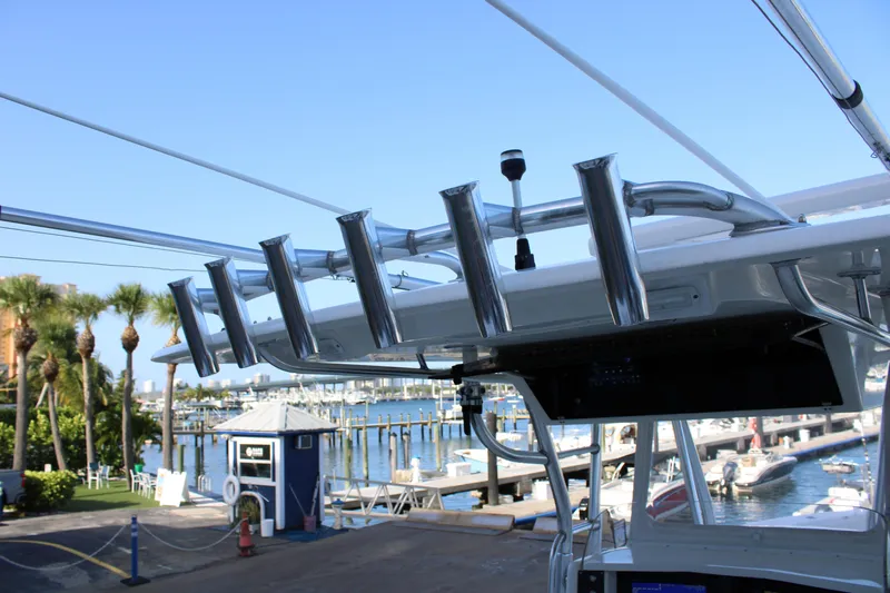  Yacht Photos Pics Venture 34 Open 1998 boat with rod holders, docked at marina with palm trees.
