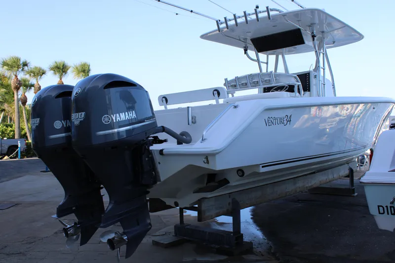  Yacht Photos Pics 1998 Venture 34 Open boat with twin Yamaha outboard engines on a trailer.