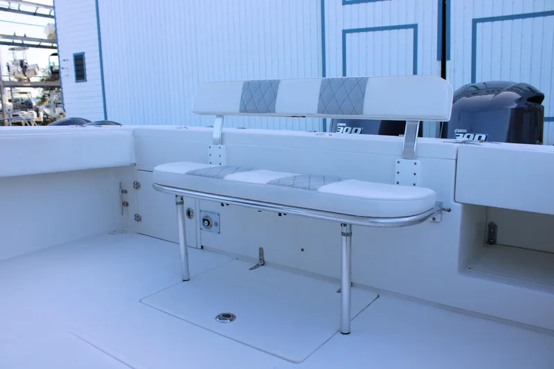  Yacht Photos Pics 1998 Venture 34 Open boat interior with cushioned seating and Yamaha engines.