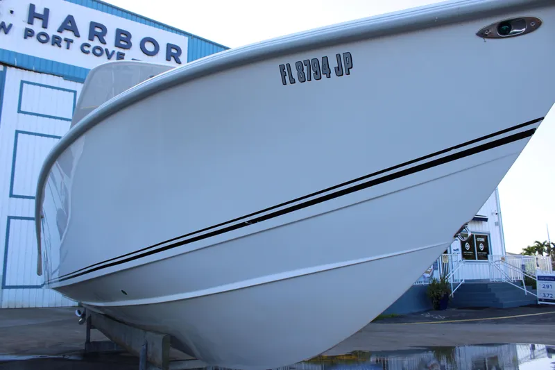  Yacht Photos Pics 1998 Venture 34 Open boat at marina, side view with registration number visible.