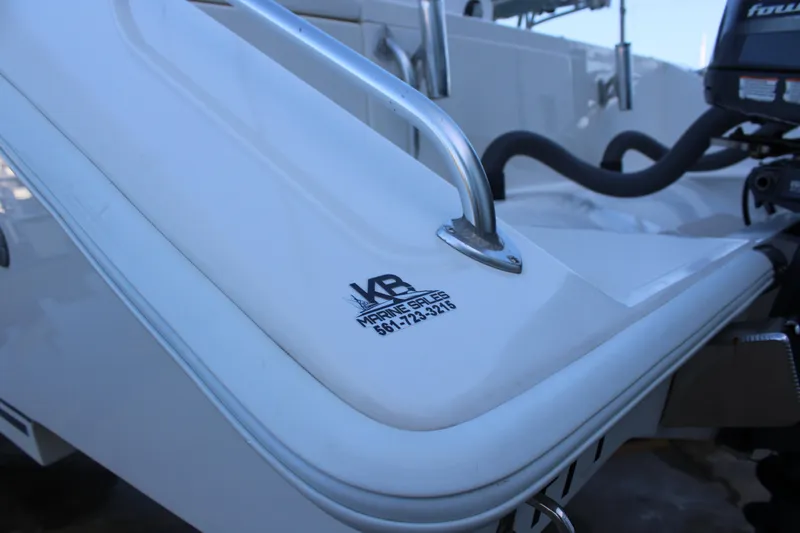  Yacht Photos Pics Close-up of a 1998 Venture 34 Open boat with KB Marine Sales logo.