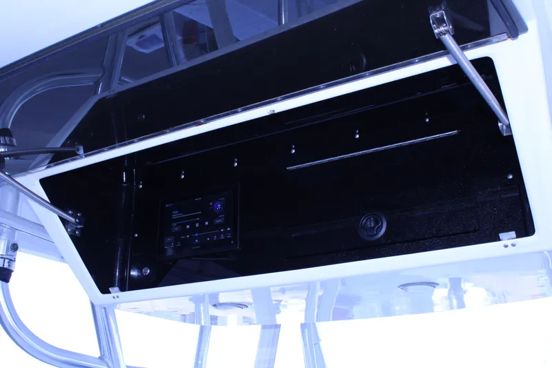  Yacht Photos Pics Open storage compartment on a 1998 Venture 34 Open boat, featuring a control panel.