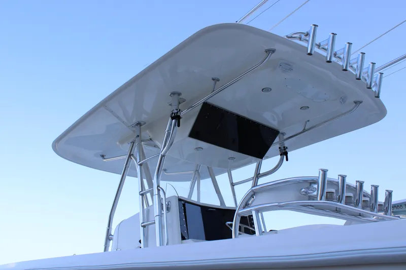  Yacht Photos Pics Venture 34 Open 1998 boat with sleek T-top and rod holders against clear sky.