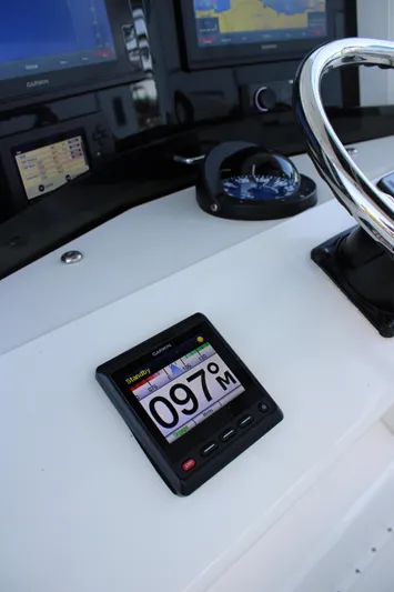  Yacht Photos Pics Control panel of 1998 Venture 34 Open boat with Garmin display and compass.