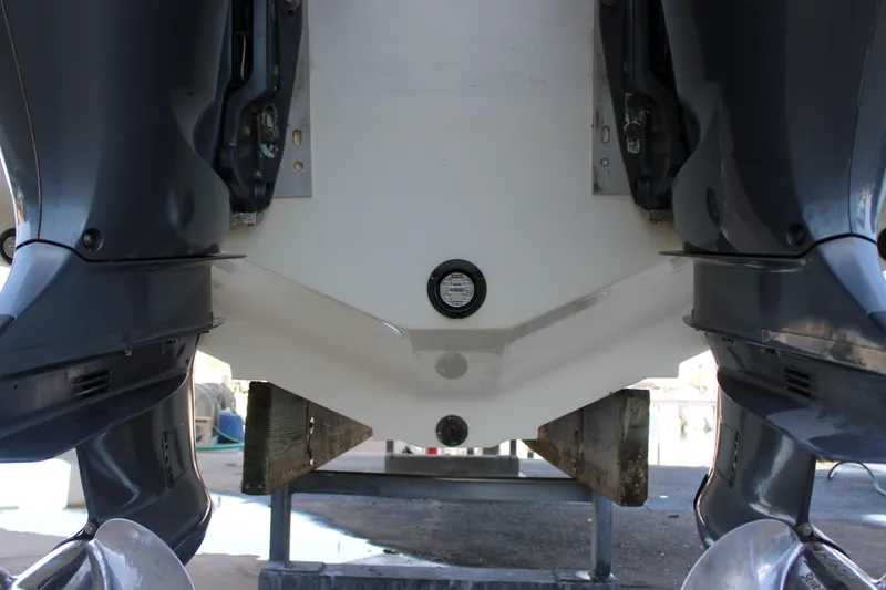  Yacht Photos Pics 1998 Venture 34 Open boat stern with dual outboard motors on a stand.