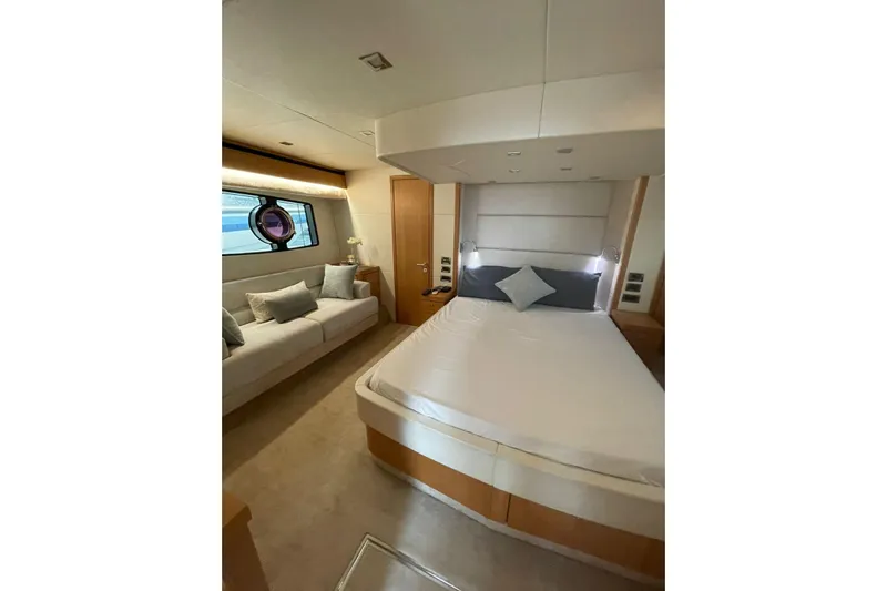  Yacht Photos Pics Luxurious bedroom interior of 2012 Sunseeker Manhattan 70 yacht with modern furnishings.