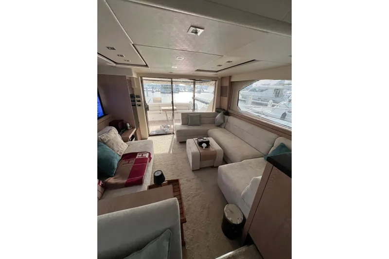  Yacht Photos Pics Luxurious interior of 2012 Sunseeker Manhattan 70 yacht with elegant seating and large windows.