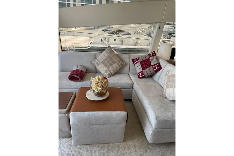  Yacht Photos Pics Luxurious interior of 2012 Sunseeker Manhattan 70 yacht with elegant seating and decorative pillows.