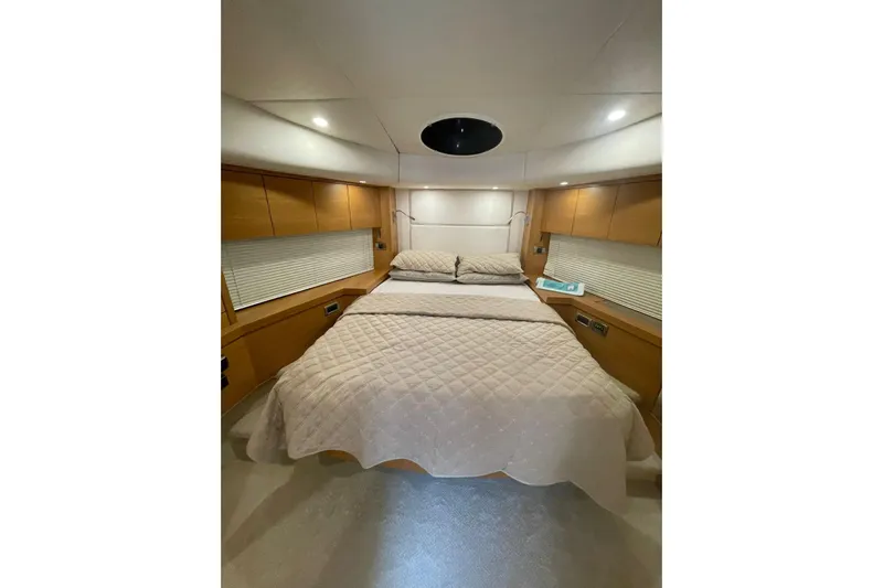  Yacht Photos Pics Luxurious bedroom interior of 2012 Sunseeker Manhattan 70 yacht with cozy bedding.