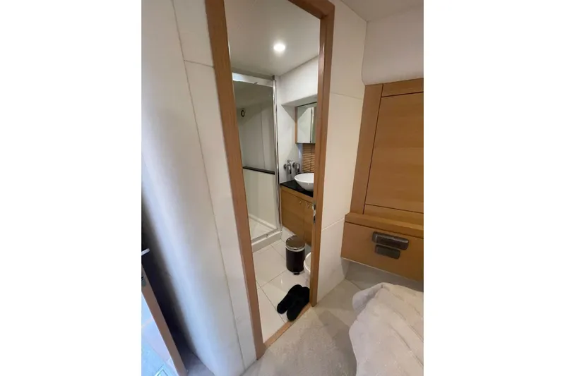  Yacht Photos Pics Luxurious bathroom interior of 2012 Sunseeker Manhattan 70 yacht, featuring modern fixtures.