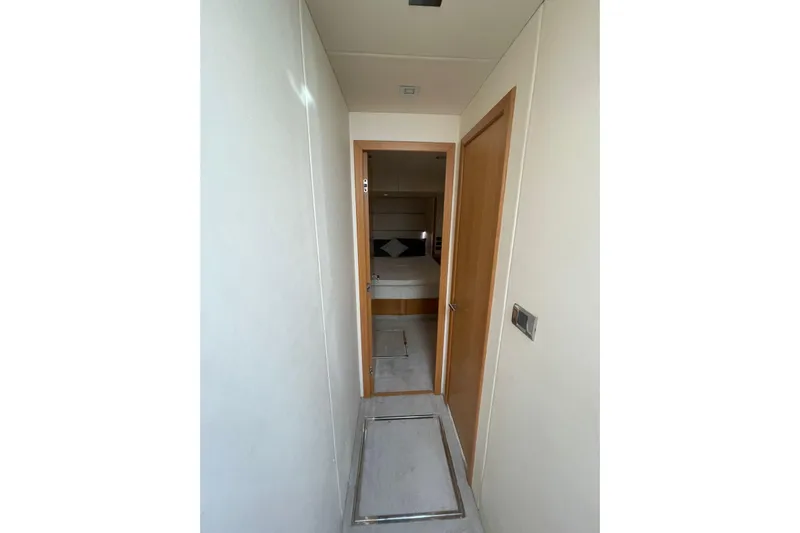  Yacht Photos Pics Narrow hallway leading to a bedroom on a 2012 Sunseeker Manhattan 70 yacht.
