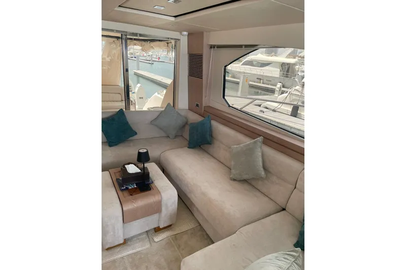  Yacht Photos Pics Luxurious interior of 2012 Sunseeker Manhattan 70 yacht with plush seating and elegant decor.